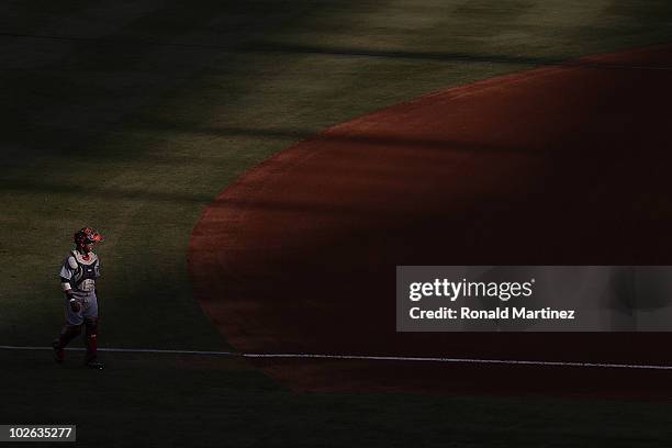 Catcher Carlos Santana of the Cleveland Indians walks on the field before a game against the Texas Rangers on July 5, 2010 at Rangers Ballpark in...