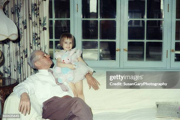 grandpa  and granddaughter easter  - 1950 1959 photos stock pictures, royalty-free photos & images