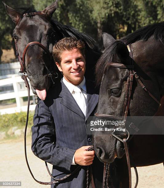 Elite Equestrian Rider Nick Haness poses with horses Ned and Southern during a photo shoot on July 5, 2010 in Silverado, California.