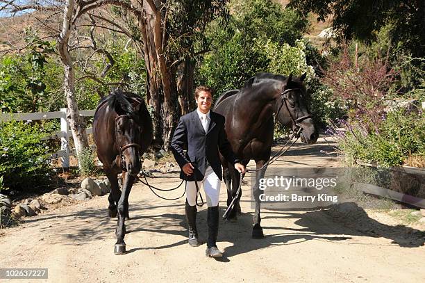 Elite Equestrian Rider Nick Haness poses with Horses Ned and Southern during a photo shoot on July 5, 2010 in Silverado, California.