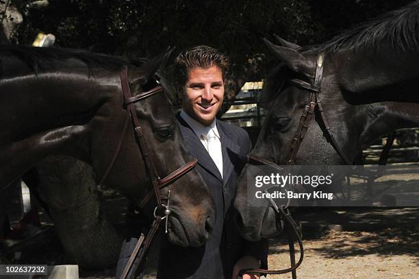 Elite Equestrian Rider Nick Haness poses with horses Ned and Southern during a photo shoot on July 5, 2010 in Silverado, California.