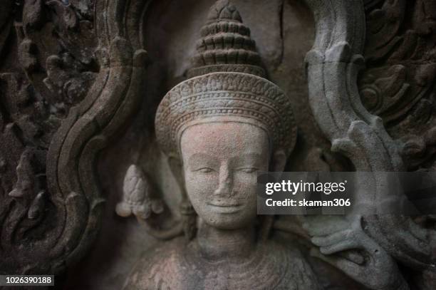 stone carving of apsara dancer in angkor wat  siemreap cambodia - apsara stockfoto's en -beelden