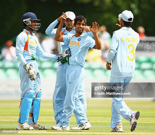 Iqbal Abdulla of India is congratulated on bowling Steve Davies of England for LBW during the One Day International match between England Lions and...