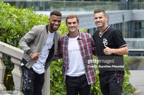 Thomas Lemar, Antoine Griezmann and Lucas Hernandez arrive for a French Soccer team training session on September 3, 2018 in Etival-Clairefontaine,...