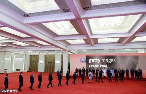 Chinese President Xi Jinping and African leaders leave walk together after a photo session during the Forum on China-Africa Cooperation 2018 Beijing...