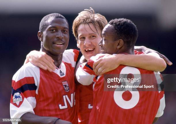 Paul Merson of Arsenal celebrates with teammates Kevin Campbell and Ian Wright during the FA Premier League match between Arsenal and Sheffield...