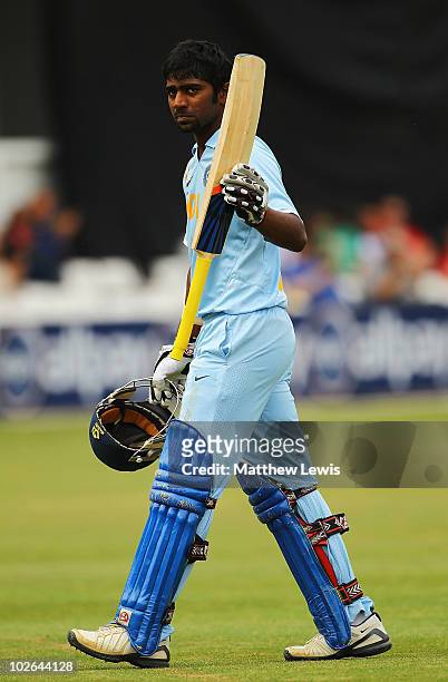 Abhinav Mukund of India walks off, after he was bowled by Ravi Bopara of England during the One Day International match between England Lions and...