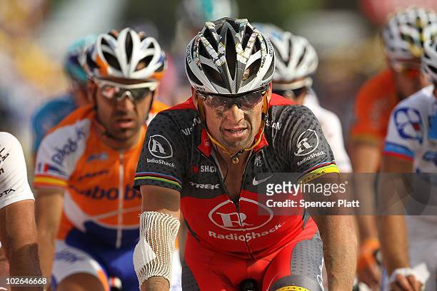 American Lance Armstrong with team RadioShack arrives over the finish along the 213km stage three of the Tour de France on July 6, 2010 in Arenberg,...