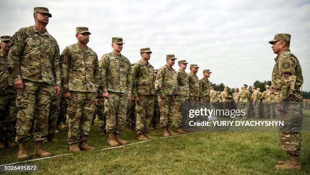 Soldiers listen to their commander at the training ground in Starytchi, outside Lviv on September 3, 2018. - Ukraine launched joint military...