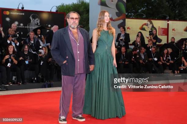 Julian Schnabel and Louise Kugelberg walk the red carpet ahead of the 'At Eternity's Gate' screening during the 75th Venice Film Festival at Sala...