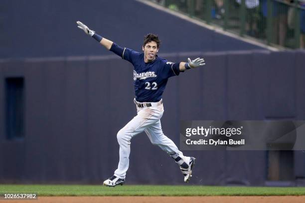 Christian Yelich of the Milwaukee Brewers celebrates after hitting a fielder's choice to beat the Chicago Cubs 4-3 at Miller Park on September 3,...