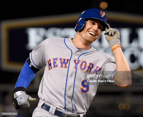 Brandon Nimmo of the New York Mets celebrates his three run homerun to take a 4-1 lead over the Los Angeles Dodgers during the ninth inning at Dodger...