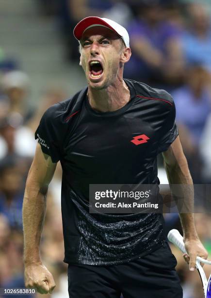 John Millman of Australia shows his emotions during the men's singles fourth round match against Roger Federer of Switzerland on Day Eight of the...