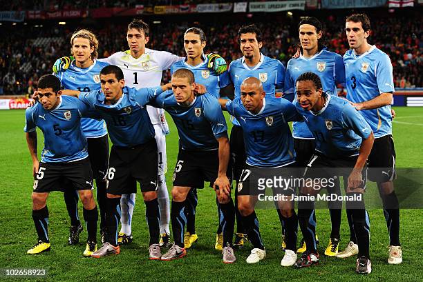 The Uruguay team line up ahead of the 2010 FIFA World Cup South Africa Semi Final match between Uruguay and the Netherlands at Green Point Stadium on...