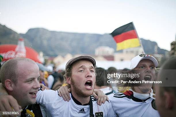 German football fans celebrate their win over England on June 30 in central Cape Town, South Africa. Thousands of fans watched the clash between the...