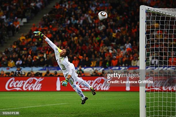 Fernando Muslera of Uruguay cannot save the shot by Giovanni Van Bronckhorst of the Netherlands as he scores the opening goal during the 2010 FIFA...