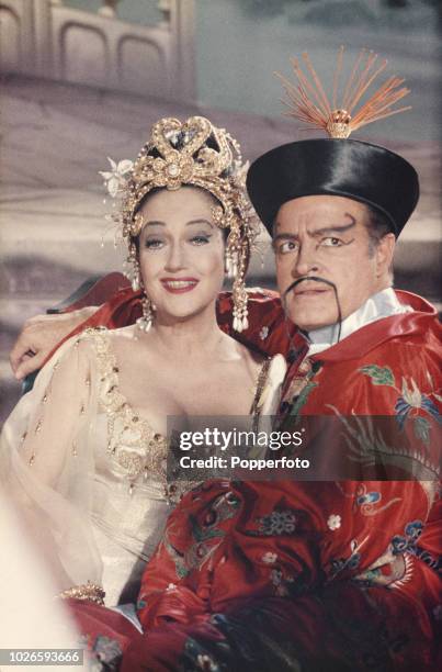 English bon American actor Bob Hope pictured dressed in character as Chester Babcock with American actress Dorothy Lamour during production of the...