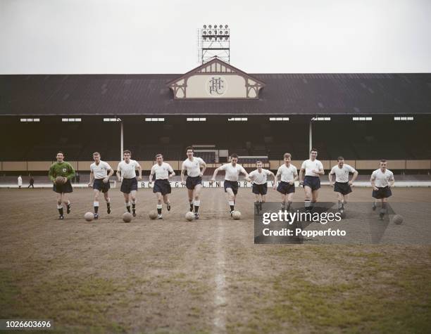 View of the Tottenham Hotspur Football Club team squad pictured on the pitch at White Hart Lane stadium in North London in May 1961. The team members...