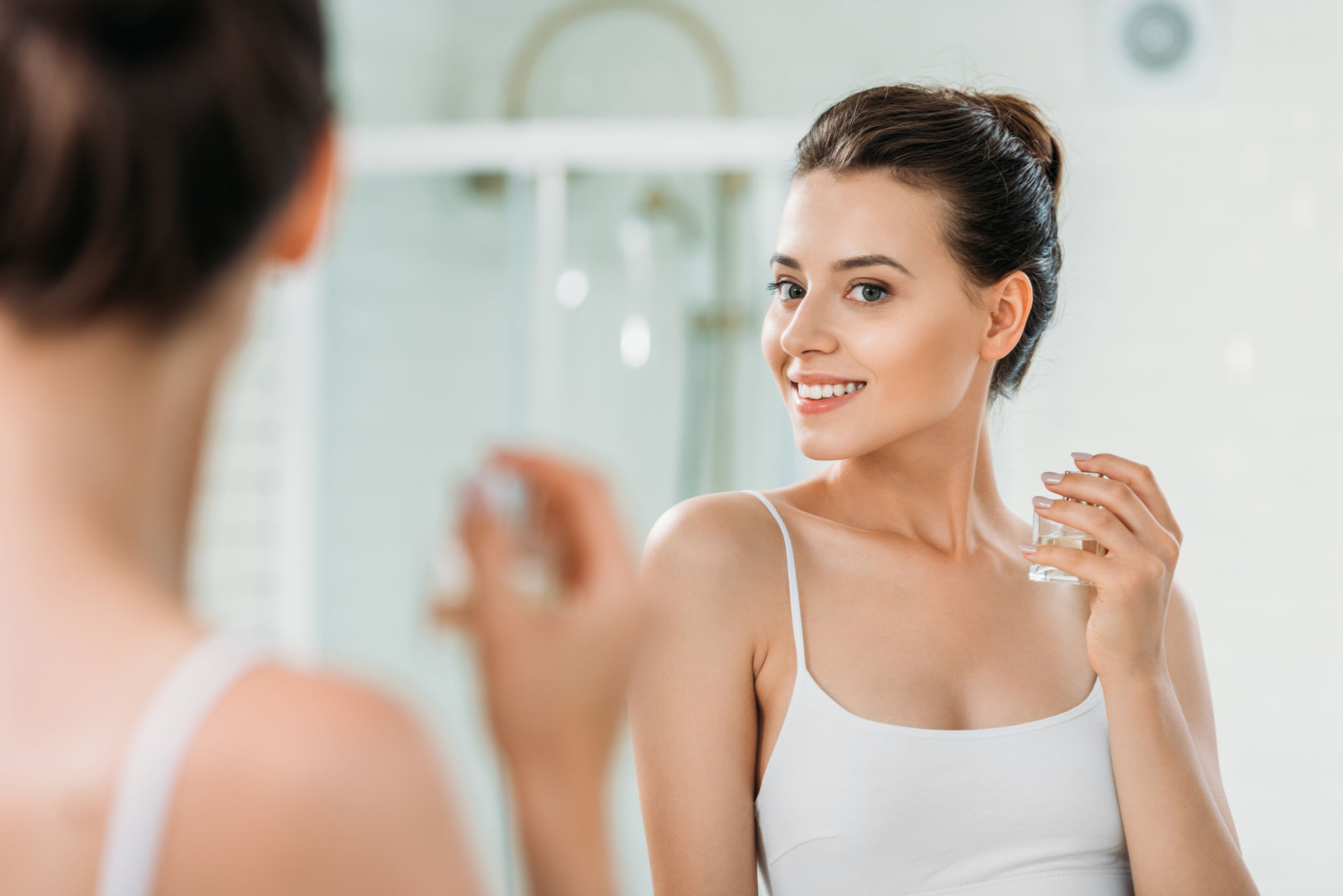 woman applying perfume