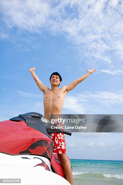 young man on a jet ski - jet boat fotografías e imágenes de stock