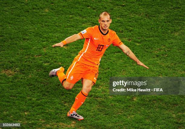 Wesley Sneijder of the Netherlands celebrates scoring the second goal during the 2010 FIFA World Cup South Africa Semi Final match between Uruguay...