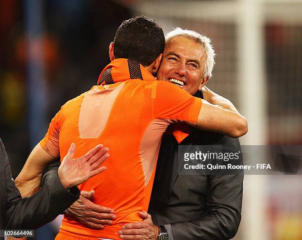 Bert van Marwijk head coach of the Netherlands celebrates with Khalid Boulahrouz after the 2010 FIFA World Cup South Africa Semi Final match between...