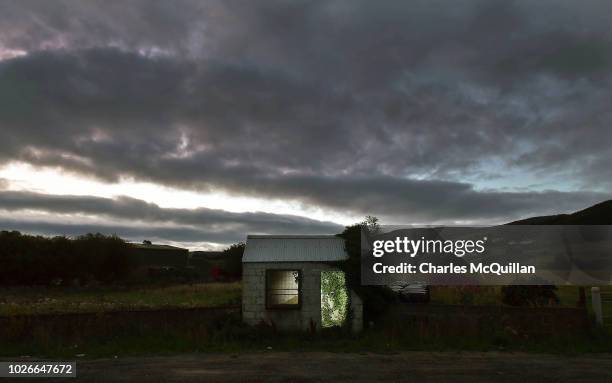 Former customs guard hut is illuminated on the Irish border on August 23, 2018 in Ravensdale, Ireland. Following the United Kingdom European Union...