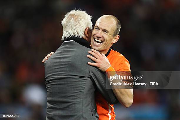 Arjen Robben of the Netherlands embraces Bert van Marwijk head coach of the Netherlands as he is substituted during the 2010 FIFA World Cup South...