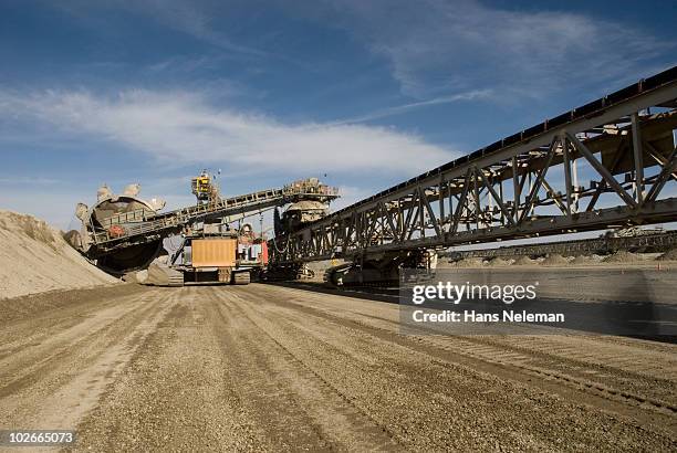 mining machine taking it's daily route. - mining machinery stock pictures, royalty-free photos & images