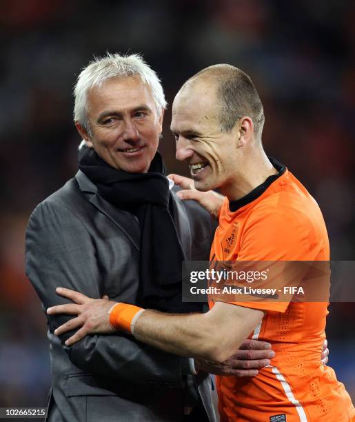 Arjen Robben of the Netherlands embraces Bert van Marwijk head coach of the Netherlands as he is substituted during the 2010 FIFA World Cup South...