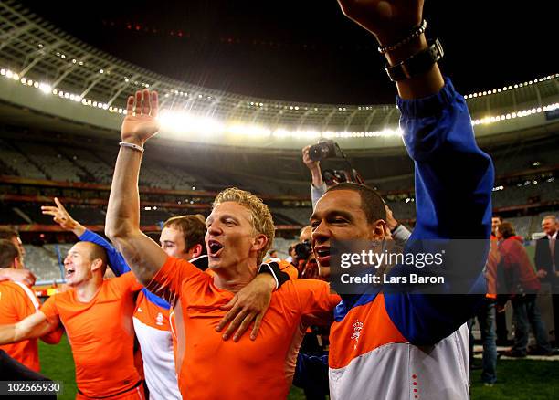Dirk Kuyt and Gregory Van Der Wiel of the Netherlands celebrate victory and progress to the final during the 2010 FIFA World Cup South Africa Semi...