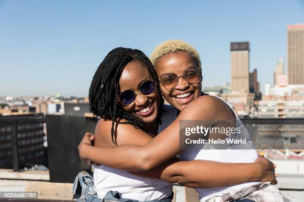 Two young women embracing