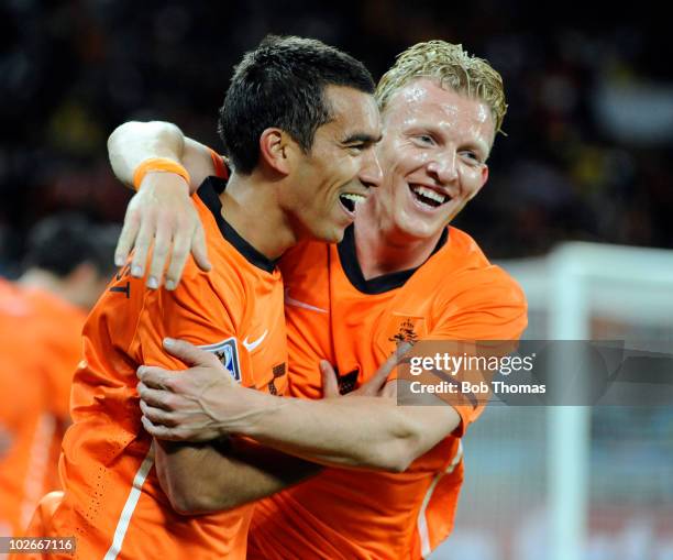 Giovanni van Bronckhorst of the Netherlands celebrates his goal with teammate Dirk Kuyt during the 2010 FIFA World Cup South Africa Semi Final match...