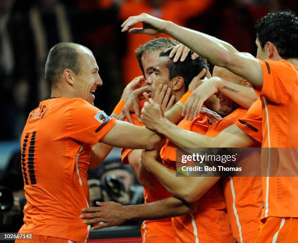 Giovanni van Bronckhorst of the Netherlands celebrates his goal with teammates including Arjen Robben during the 2010 FIFA World Cup South Africa...