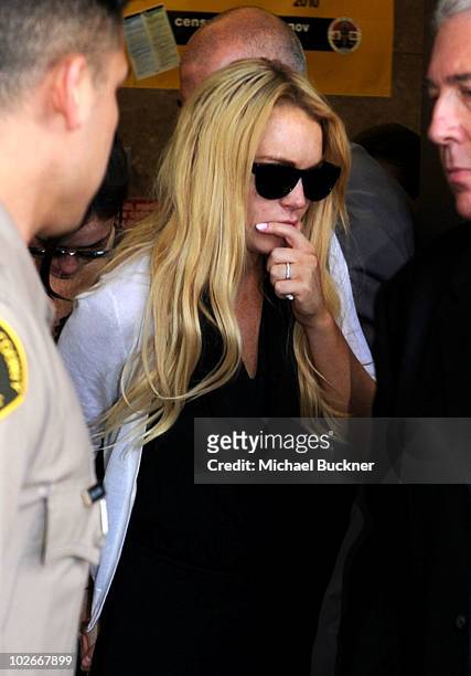 Actress Lindsay Lohan leaves Beverly Hills Courthouse after being found in violation of probation and will return to surrender July 20, 2010 at the...