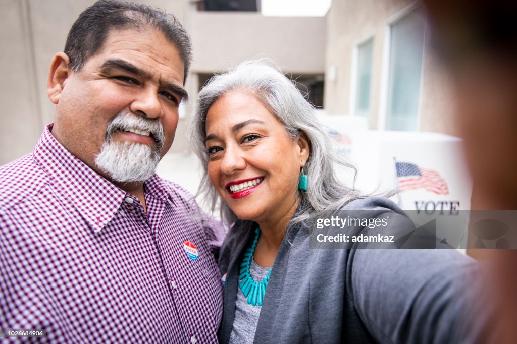 Mexican Couple Taking a Selfie at Voting Booth