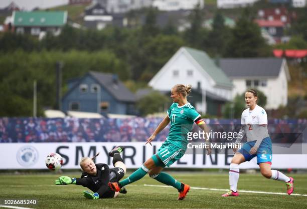 Alexandra Popp of Germany has an attempt at goal blocked by Anna Hansen of Faeroe Islands the Faeroe Islands Women's v Germany Women's 2019 FIFA...