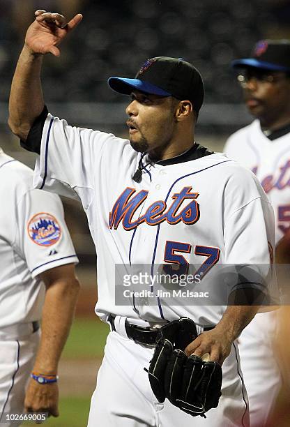 Johan Santana of the New York Mets salutes the crowd as he walks off the field after pitching a shutout against the Cincinnati Reds on July 6, 2010...