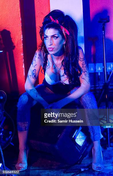 Amy Winehouse makes a surprise appearance with Mark Ronson at the 100 Club on July 6, 2010 in London, England.