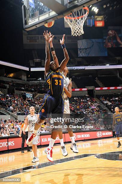 Tina Charles of the Connecticut Sun shoots against Michelle Snow of the San Antonio Silver Stars on July 6, 2010 at the AT&T Center in San Antonio,...