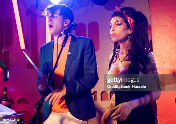 Amy Winehouse makes a surprise appearance as she performs with Mark Ronson at the 100 Club on July 6, 2010 in London, England.