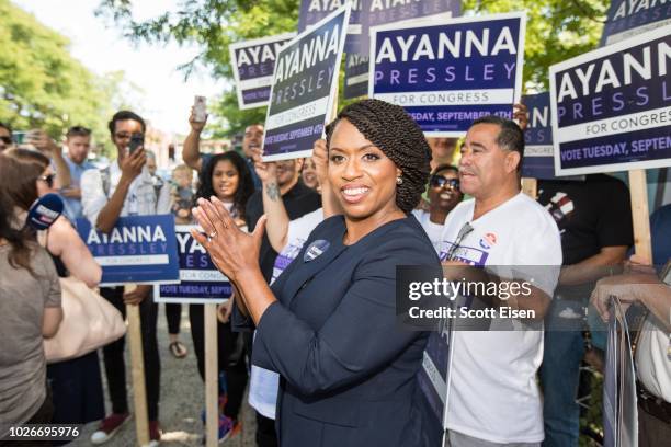 Boston City Councilwomen And House Democratic Candidate Ayanna Pressley applauds in front of her supporters during primary day on September 4, 2018...