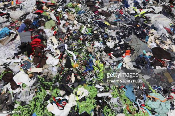 garments factory waste dumping sites - landfill stock pictures, royalty-free photos & images