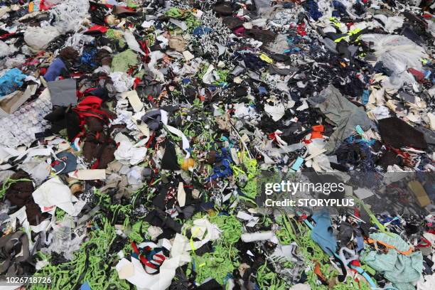 garments factory waste dumping sites - recycled textile stock pictures, royalty-free photos & images