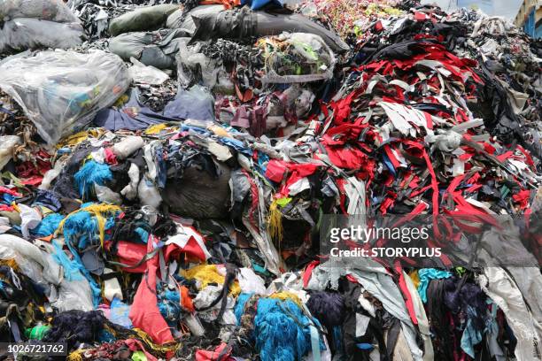 garments factory waste dumping sites - bangladesh stock-fotos und bilder
