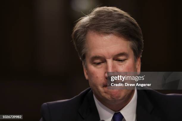 Judge Brett Kavanaugh pauses while delivering his opening statement during his Supreme Court confirmation hearing before the Senate Judiciary...