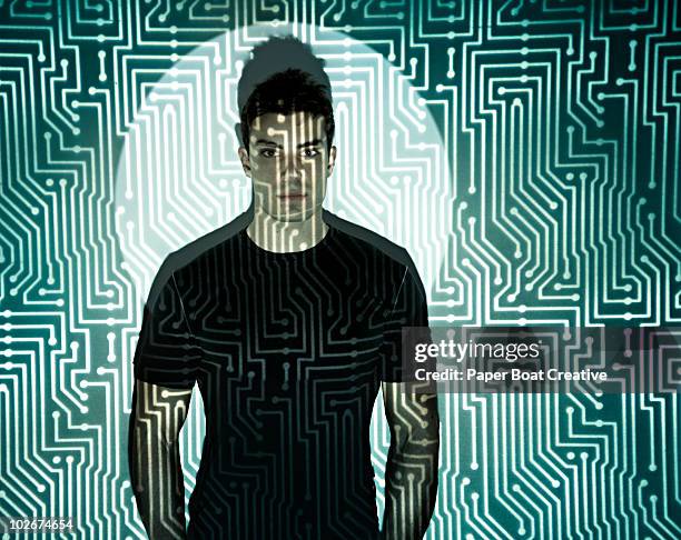 man standing in the middle of microchip projection - chips on paper stock pictures, royalty-free photos & images