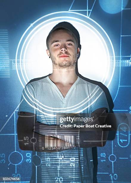 man standing in spotlight with math projection - spotlight person stock pictures, royalty-free photos & images