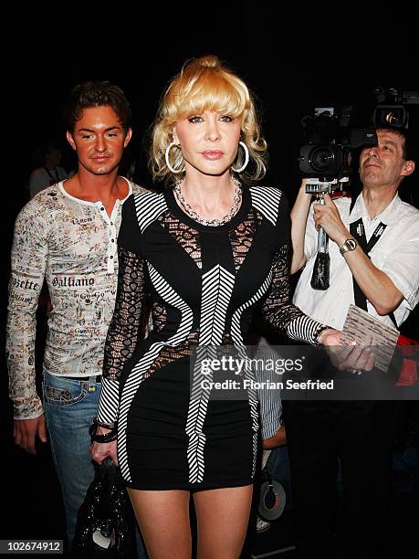 Dolly Buster and boyfriend Tim arrive at the Lena Hoschek Show during the Mercedes Benz Fashion Week Spring/Summer 2011 at Bebelplatz on July 7, 2010...