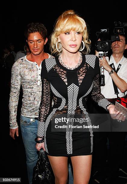 Dolly Buster and boyfriend Tim arrive at the Lena Hoschek Show during the Mercedes Benz Fashion Week Spring/Summer 2011 at Bebelplatz on July 7, 2010...